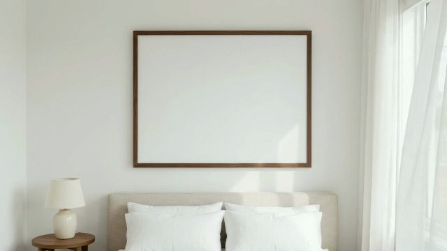 Landscape Frame Video Mockup: Walnut Frame Above a Bed with Linen Curtains video mockup